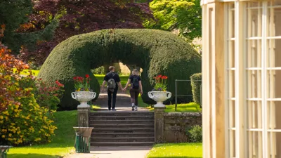 Couple holding hands in The Gardens at Alton Towers Resort