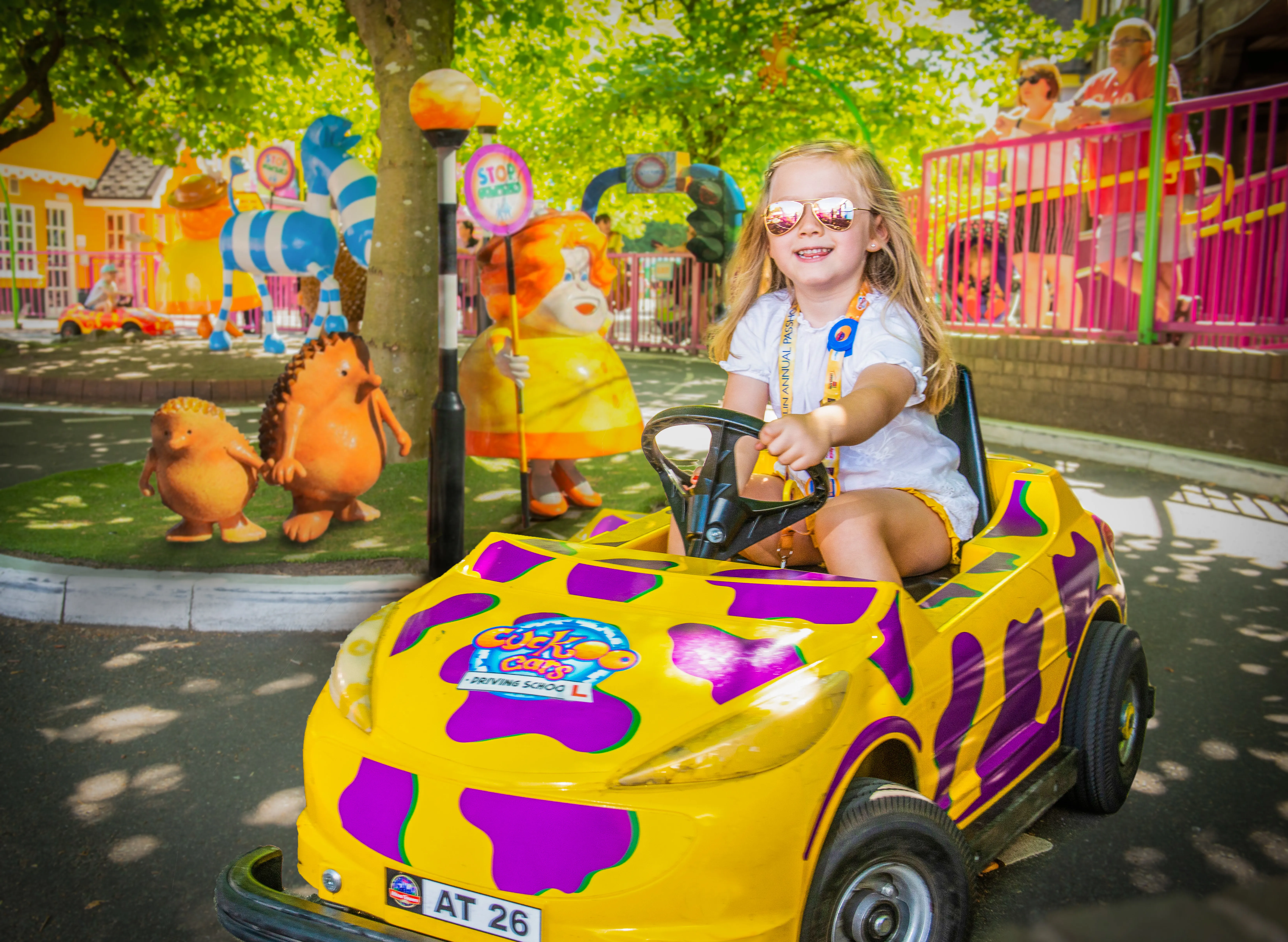 Cuckoocars Girl driving yellow and purple car